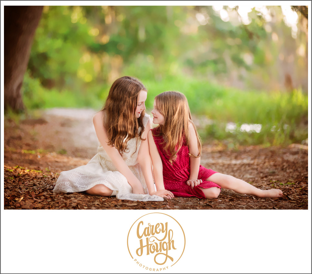Lakes-Region-NH-child-photographer-photo-of-girls-sitting-near-a-swimming-hole